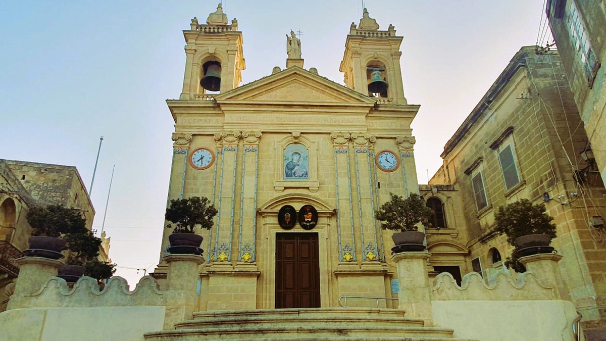 Kercem Parish Church displaying two clocks, Gozo, Malta