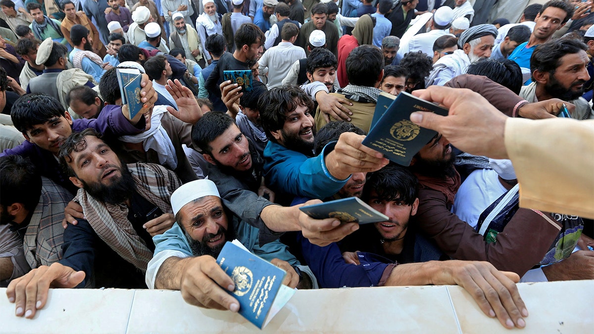 An Afghan crowd becomes chaotic as they vie for visas.